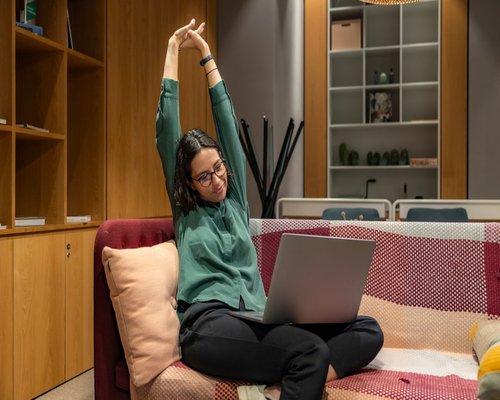 Woman doing yoga stretching at home